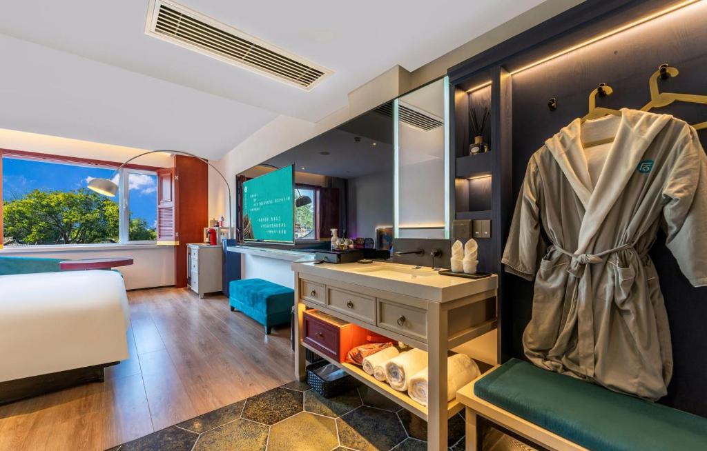 Postel nebo postele na pokoji v ubytování Houhai Hotel