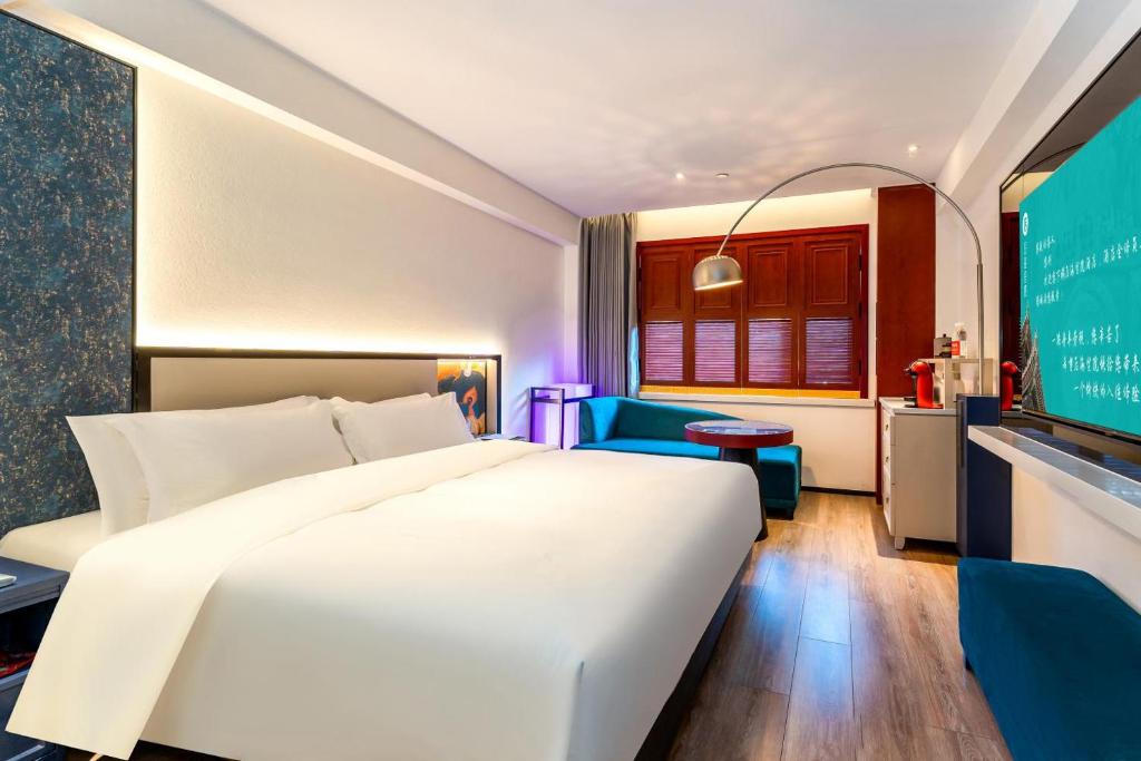 Postel nebo postele na pokoji v ubytování Houhai Hotel