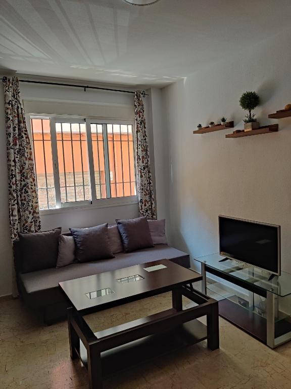 TV a/nebo společenská místnost v ubytování playa Almería zapillo loft