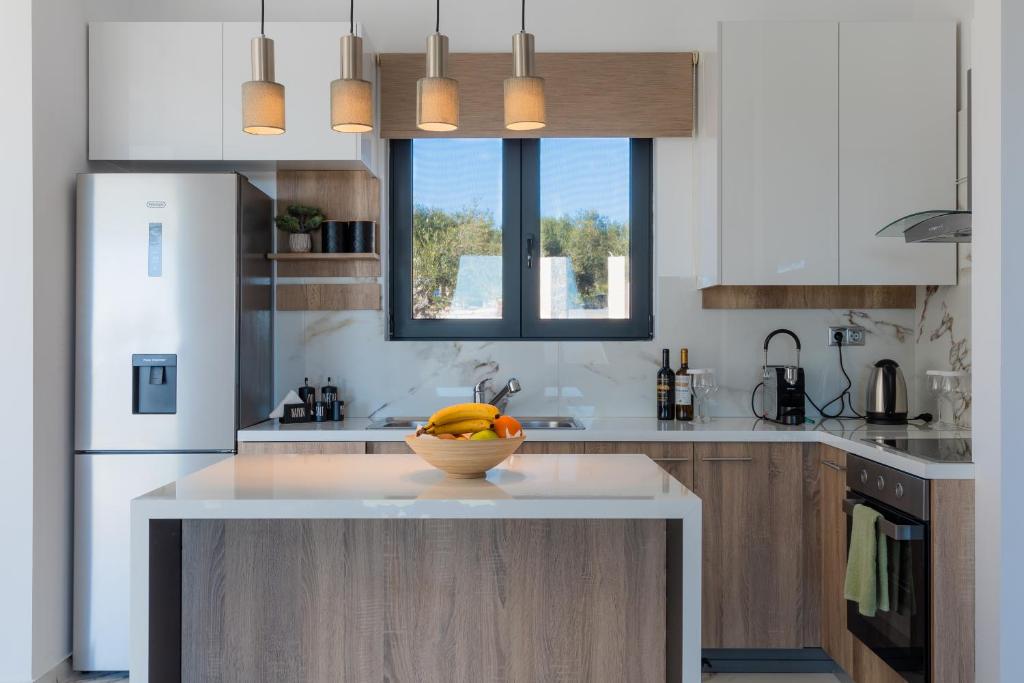 A kitchen or kitchenette at Villa Olivum by PosarelliVillas
