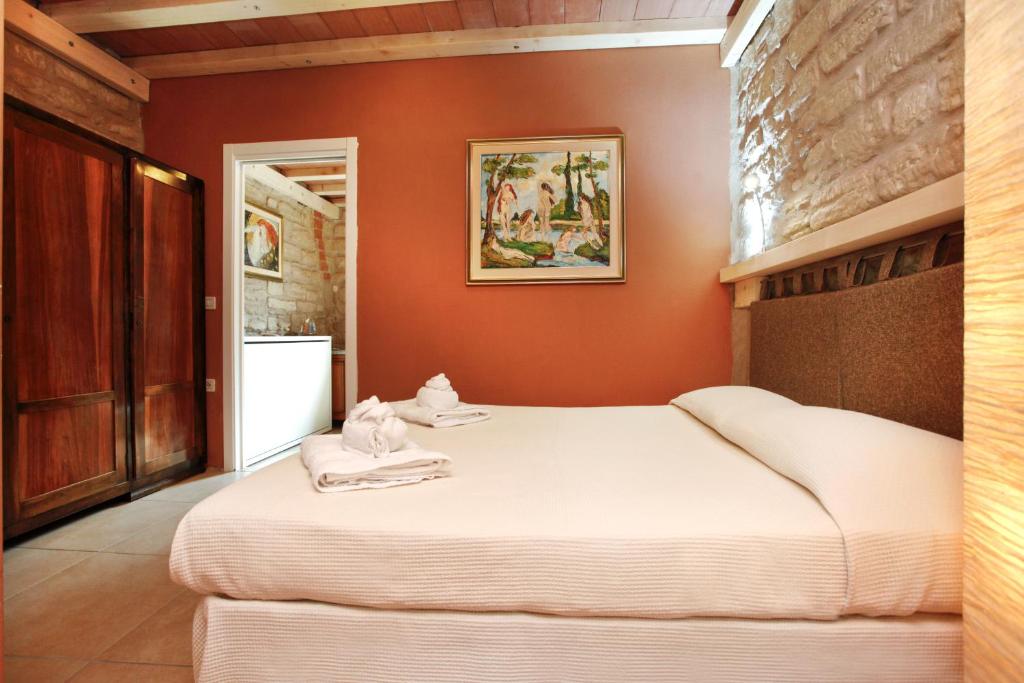 Postel nebo postele na pokoji v ubytování Albergo Garni Orchidea