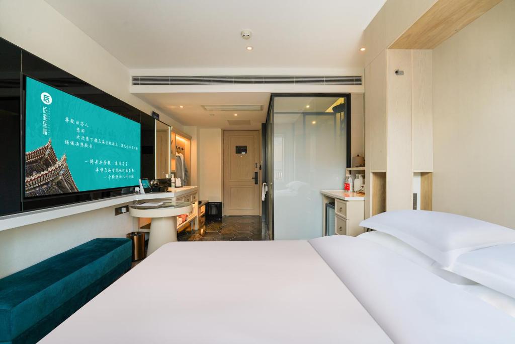 Postel nebo postele na pokoji v ubytování Houhai Hotel