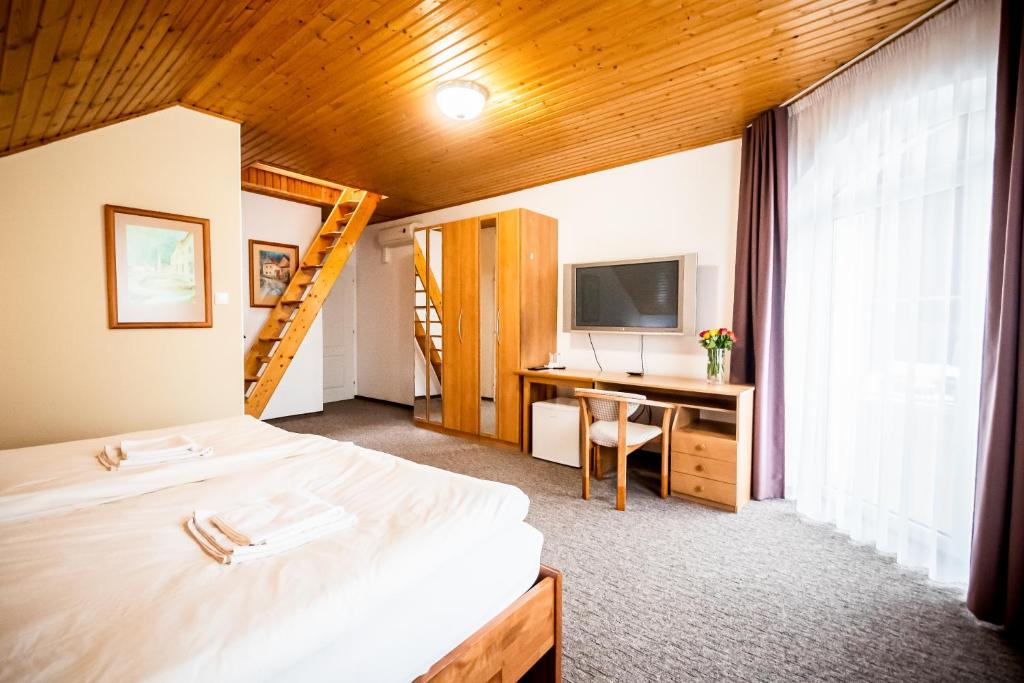 Postel nebo postele na pokoji v ubytování Hotel Squash Centrum