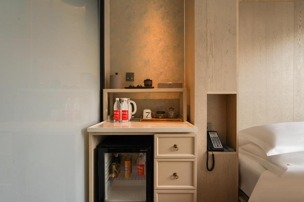 Postel nebo postele na pokoji v ubytování Houhai Hotel
