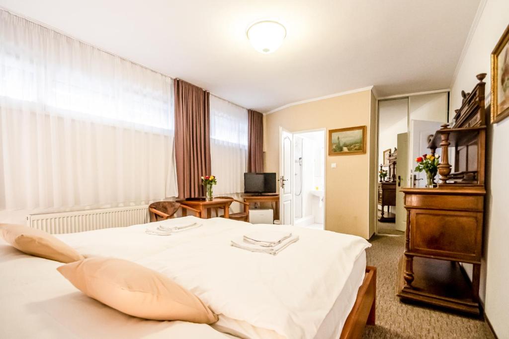Postel nebo postele na pokoji v ubytování Hotel Squash Centrum
