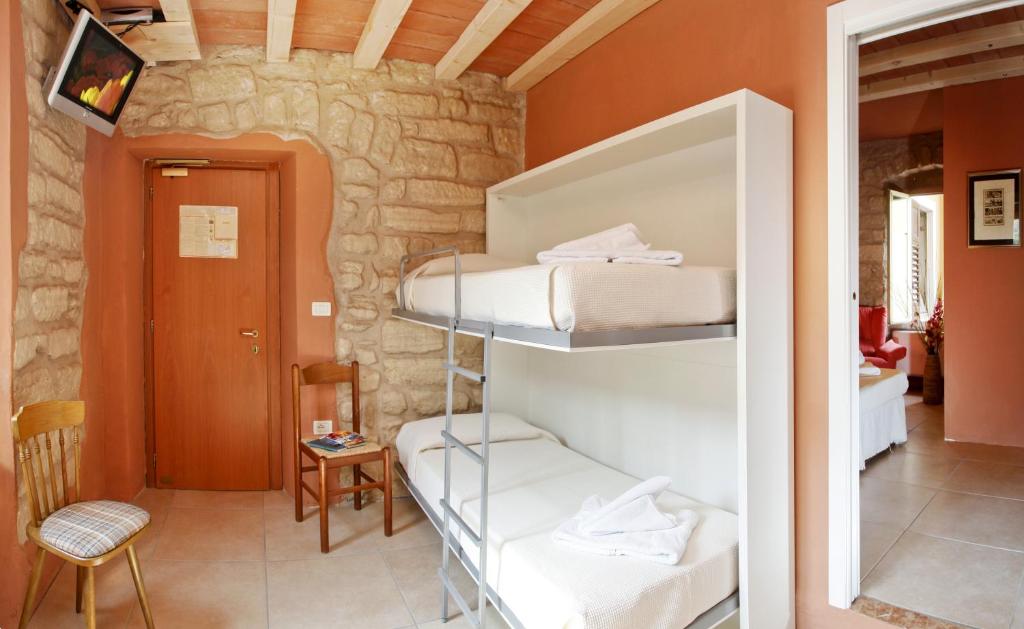 Postel nebo postele na pokoji v ubytování Albergo Garni Orchidea
