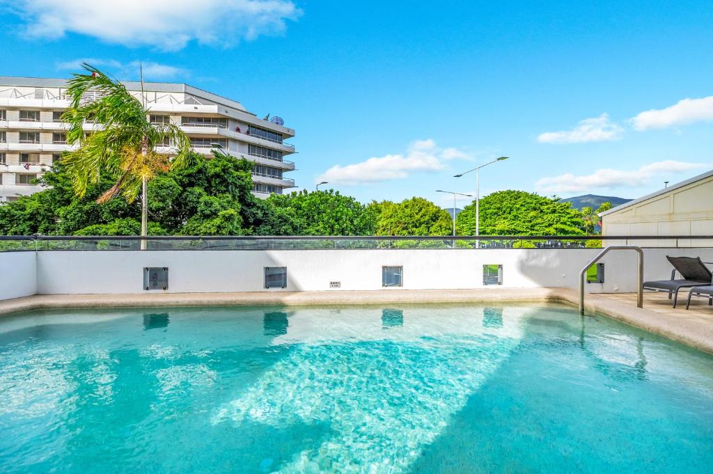 a swimming pool on the roof of a building at Oasis in the Heart of the City in Cairns