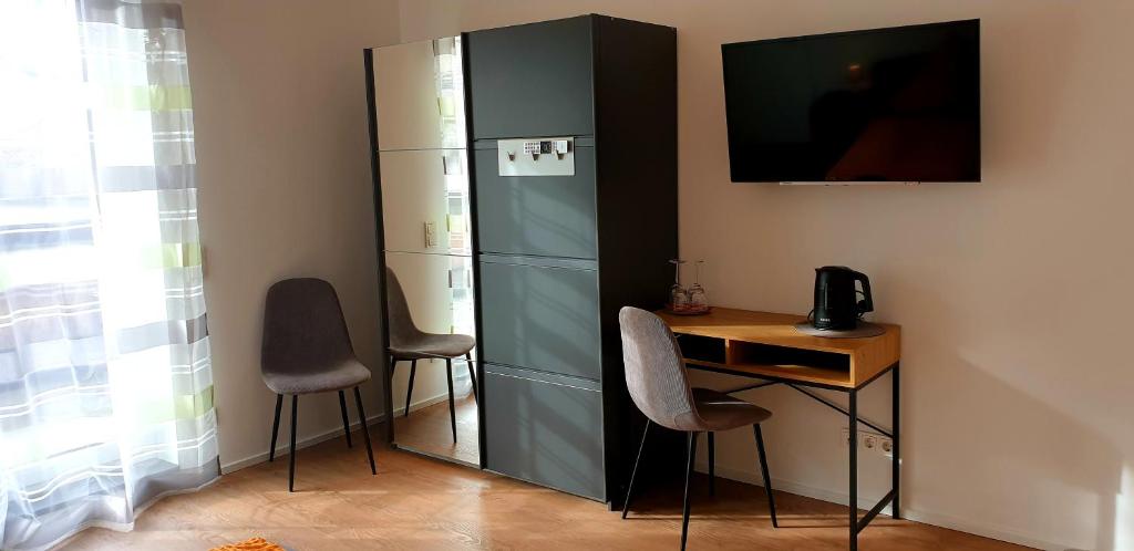 TV a/nebo společenská místnost v ubytování Weingut u. Gästehaus Becker