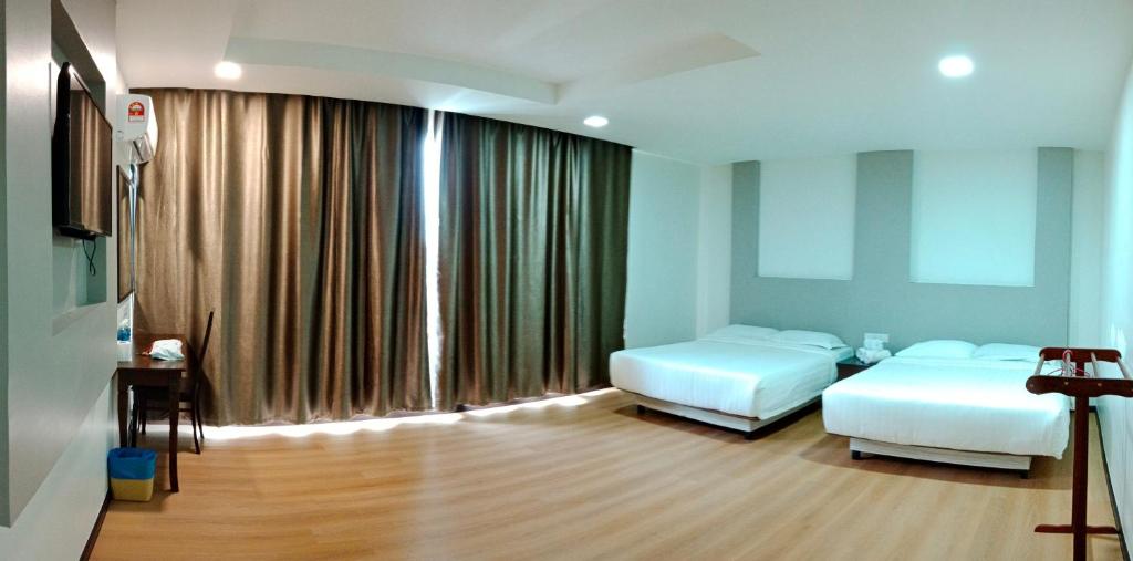 Postel nebo postele na pokoji v ubytování TOWERMAS HOTEL