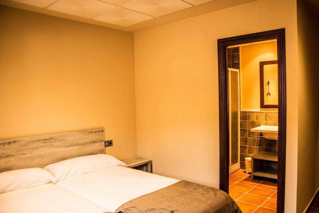 Postel nebo postele na pokoji v ubytování La Casa de la Quesería
