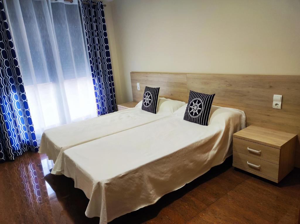 En eller flere senge i et værelse på Ancla Spaces nuevo apt cerca del mar, sin vistas
