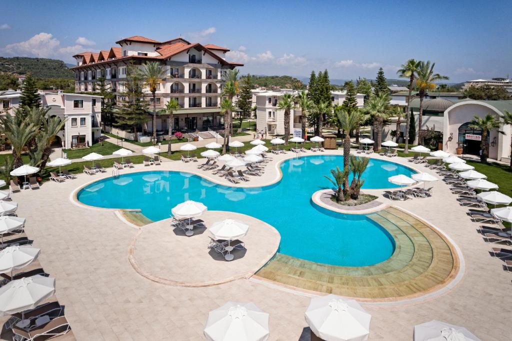an image of a swimming pool at a resort at Euphoria Barbaross Beach Resort in Kızılot