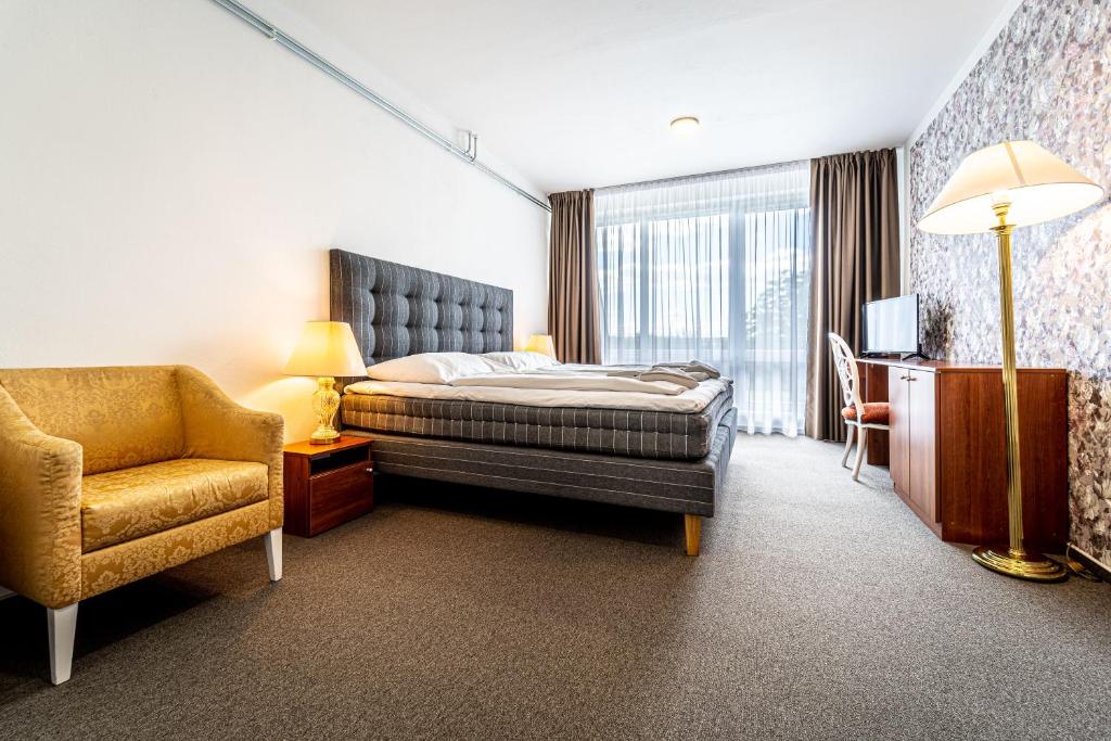 Postel nebo postele na pokoji v ubytování Hotel Fontána
