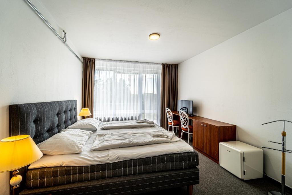 Postel nebo postele na pokoji v ubytování Hotel Fontána