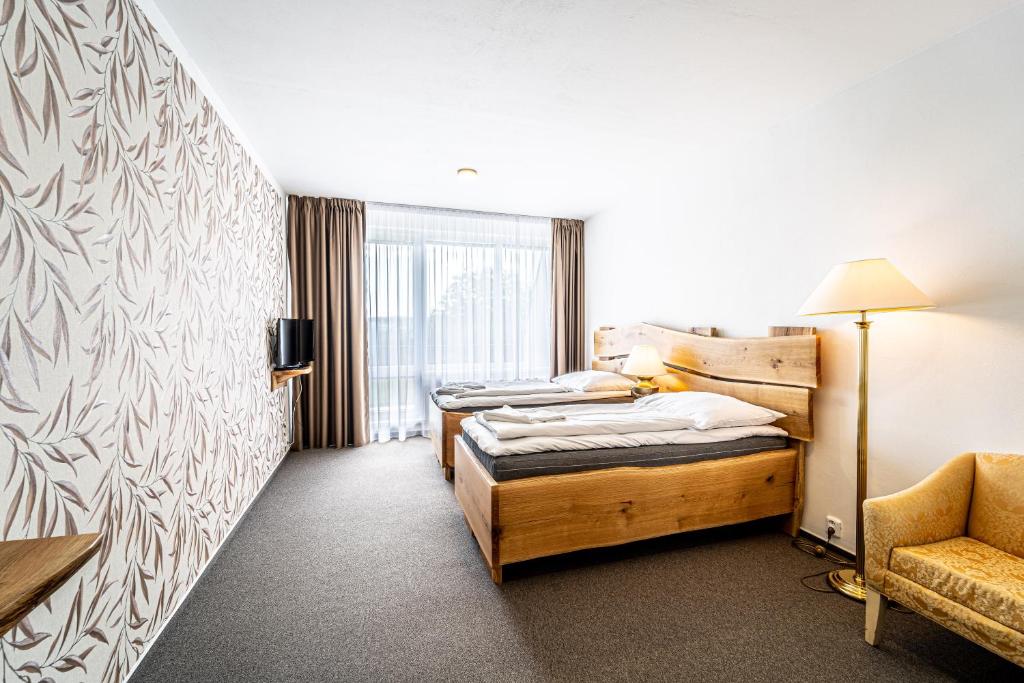 Postel nebo postele na pokoji v ubytování Hotel Fontána