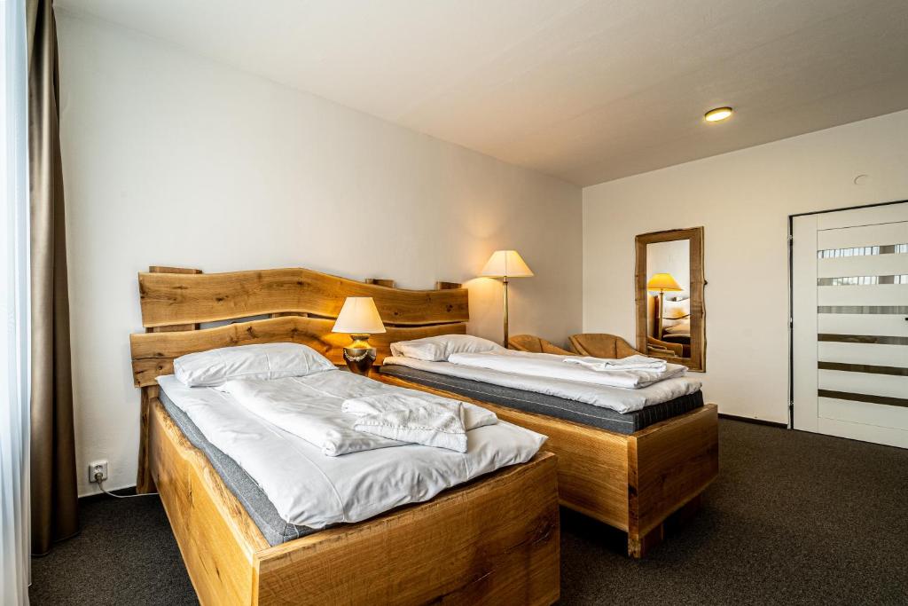 Postel nebo postele na pokoji v ubytování Hotel Fontána