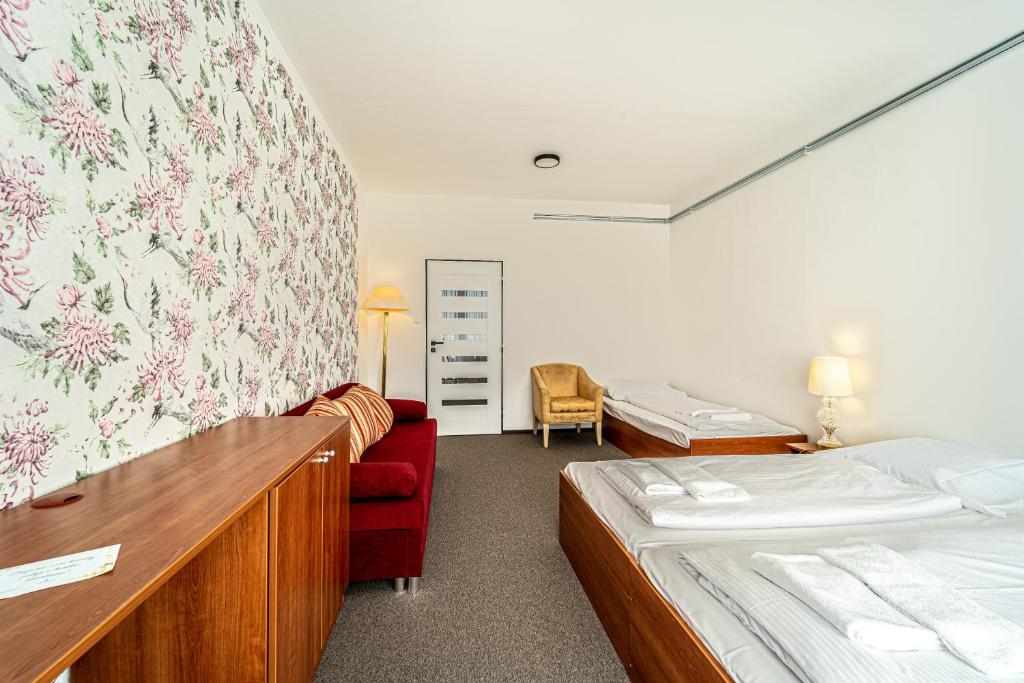 Postel nebo postele na pokoji v ubytování Hotel Fontána
