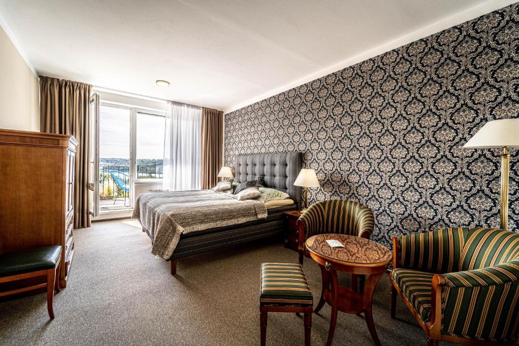 Postel nebo postele na pokoji v ubytování Hotel Fontána