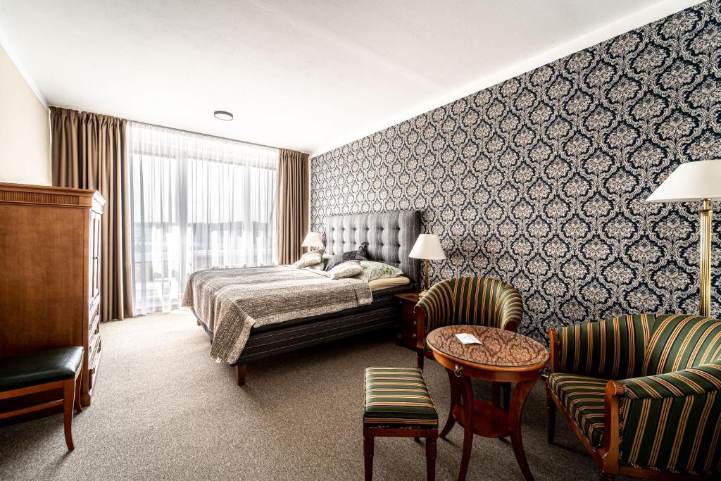 Postel nebo postele na pokoji v ubytování Hotel Fontána