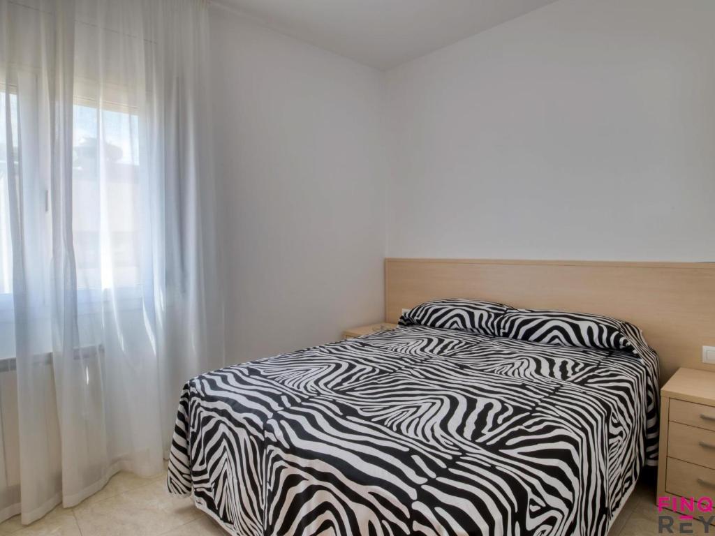 Posteľ alebo postele v izbe v ubytovaní S'agaró Centre Ap 4