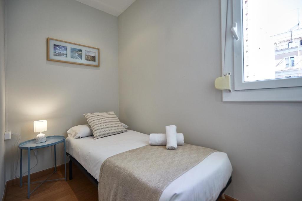 Posteľ alebo postele v izbe v ubytovaní BBarcelona Montjuic Apartment