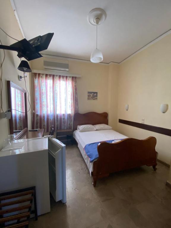 Postel nebo postele na pokoji v ubytování Hotel Areti