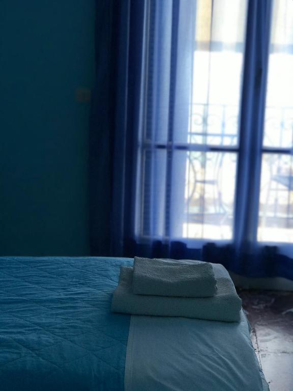 Postel nebo postele na pokoji v ubytování Hotel Areti