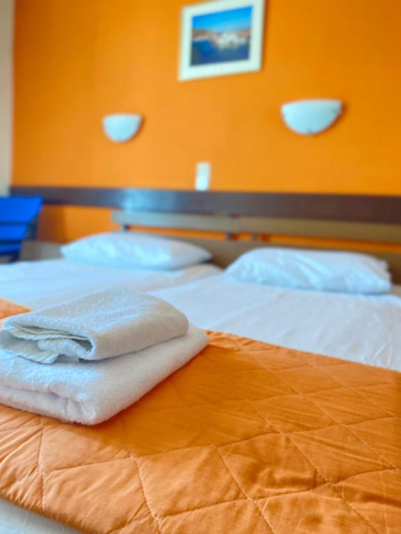 Postel nebo postele na pokoji v ubytování Hotel Areti