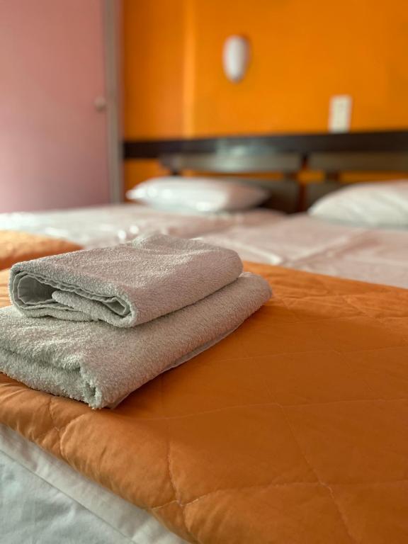 Postel nebo postele na pokoji v ubytování Hotel Areti