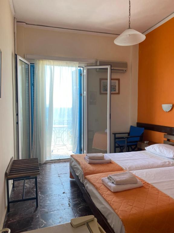 Postel nebo postele na pokoji v ubytování Hotel Areti