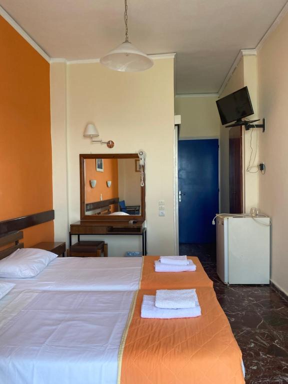 Postel nebo postele na pokoji v ubytování Hotel Areti