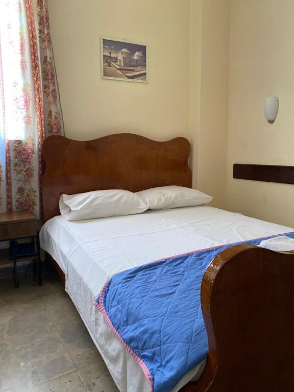 Postel nebo postele na pokoji v ubytování Hotel Areti