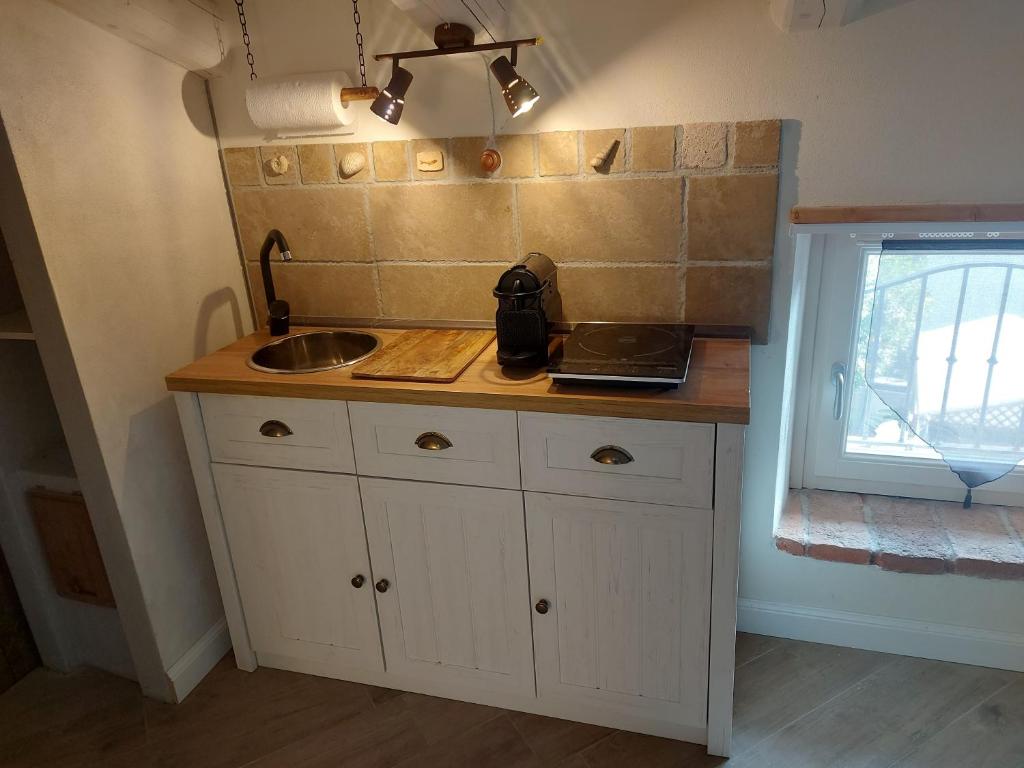 Kuchyň nebo kuchyňský kout v ubytování B&B Corte Colli Antichi
