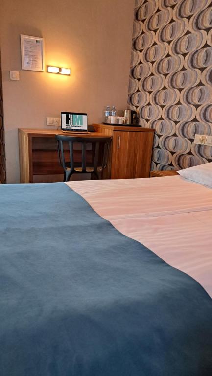 Posteľ alebo postele v izbe v ubytovaní Hotel Mazowiecki Łódź