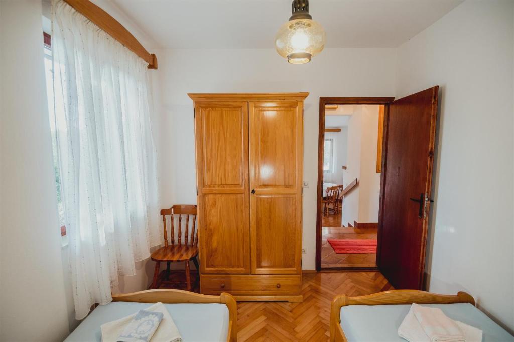 Postel nebo postele na pokoji v ubytování Apartments Antun
