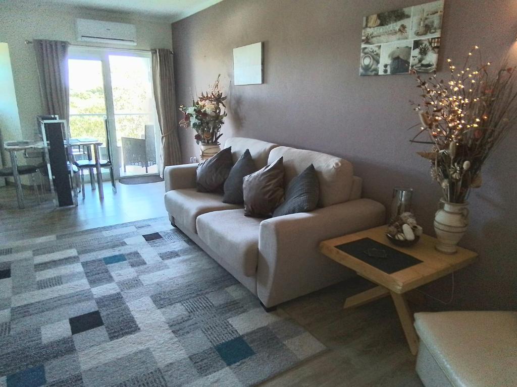 a living room with a couch and a table at Mountain View in Alvor