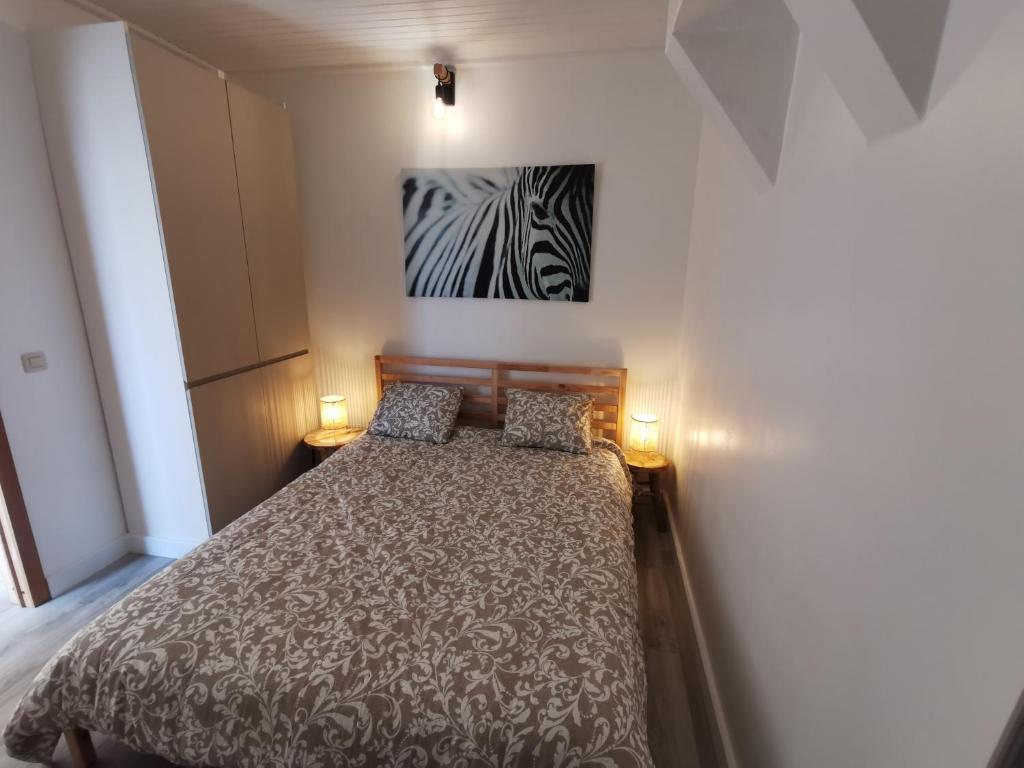 En eller flere senge i et værelse på Vakantiewoning Henri Vleteren-Ieper