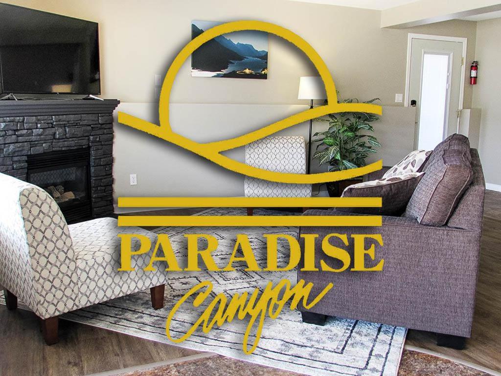 a living room with a couch and a fireplace at Paradise Canyon Golf Resort, Signature Walkout Condo 382 in Lethbridge