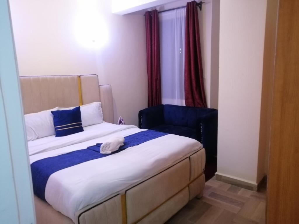 Postel nebo postele na pokoji v ubytování Nash Issah Homes-1BedRoom