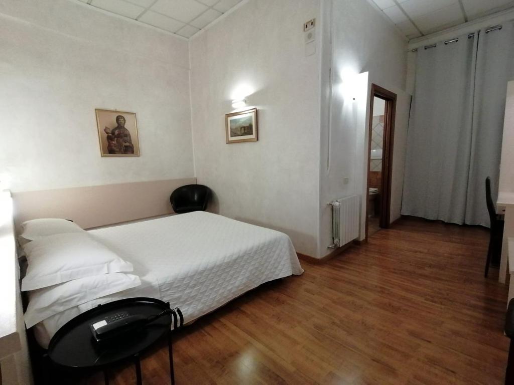 Ліжко або ліжка в номері Hotel Julia