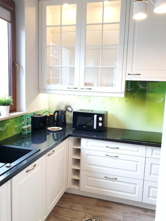 Kuchyňa alebo kuchynka v ubytovaní Prestige Verdant Apartment