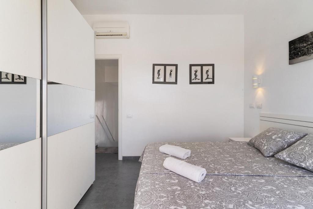 Postel nebo postele na pokoji v ubytování Moderno Triplex Sonneland