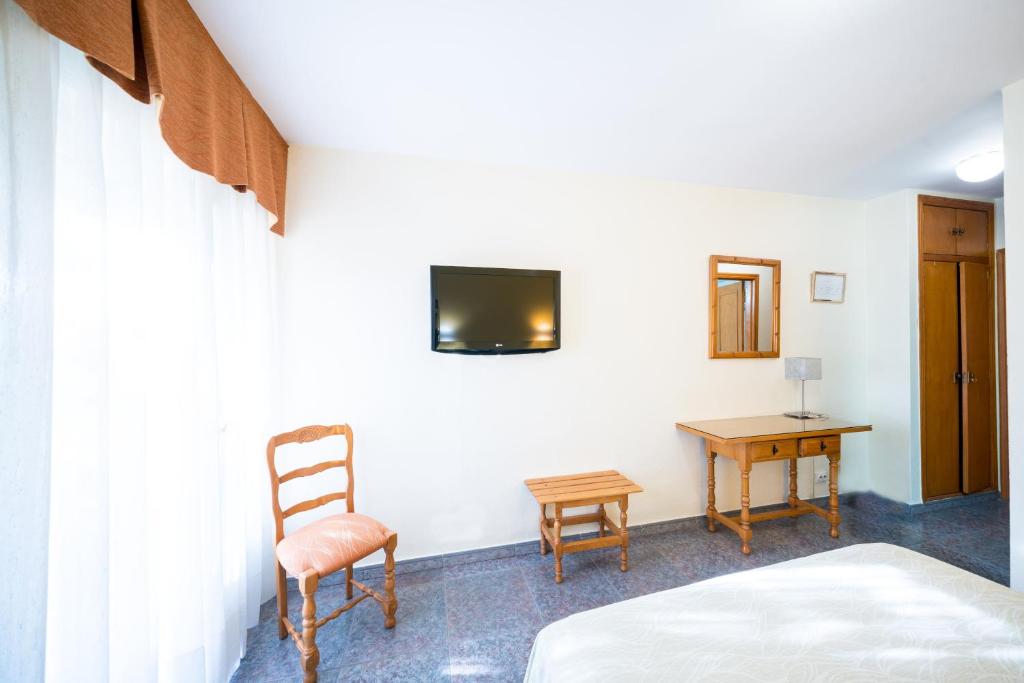 TV a/nebo společenská místnost v ubytování Hotel La Colina