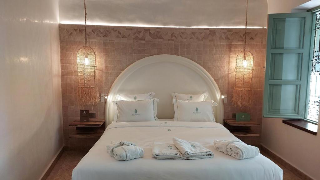 Postel nebo postele na pokoji v ubytování Riad Lalla Mimouna