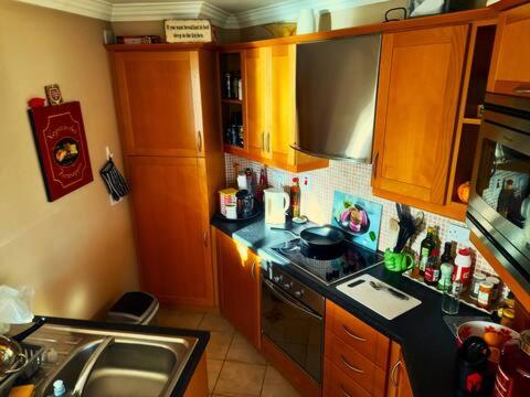 a kitchen with a sink and a stove top oven at Best Location in Tralee in Tralee