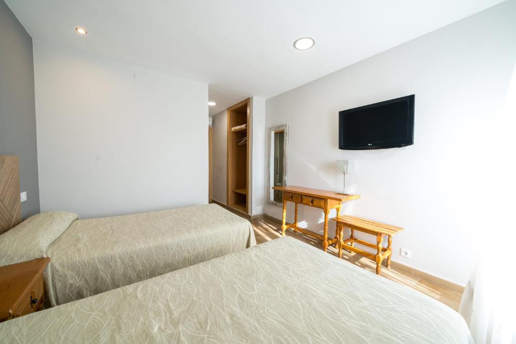 TV a/nebo společenská místnost v ubytování Hotel La Colina