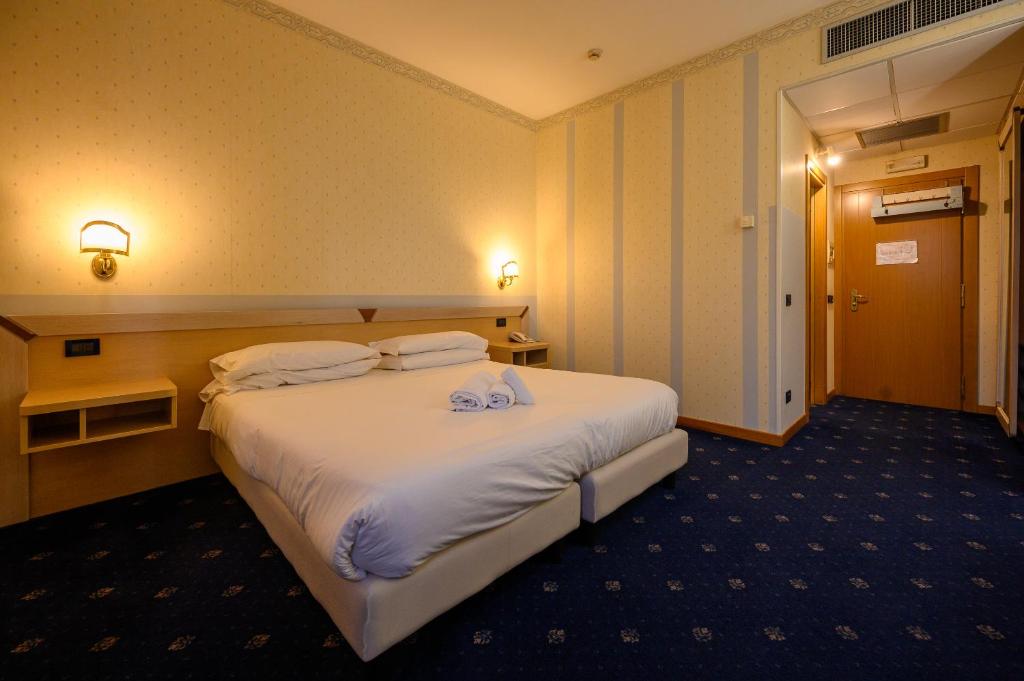 Postel nebo postele na pokoji v ubytování Hotel Torre Di Pratolungo