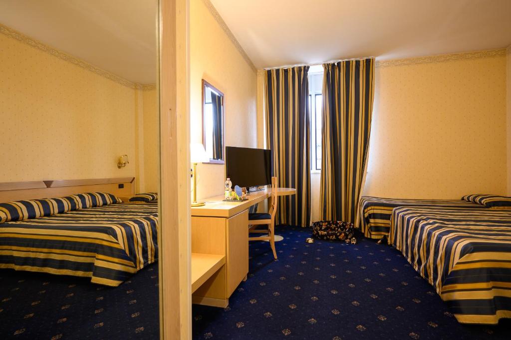 Postel nebo postele na pokoji v ubytování Hotel Torre Di Pratolungo