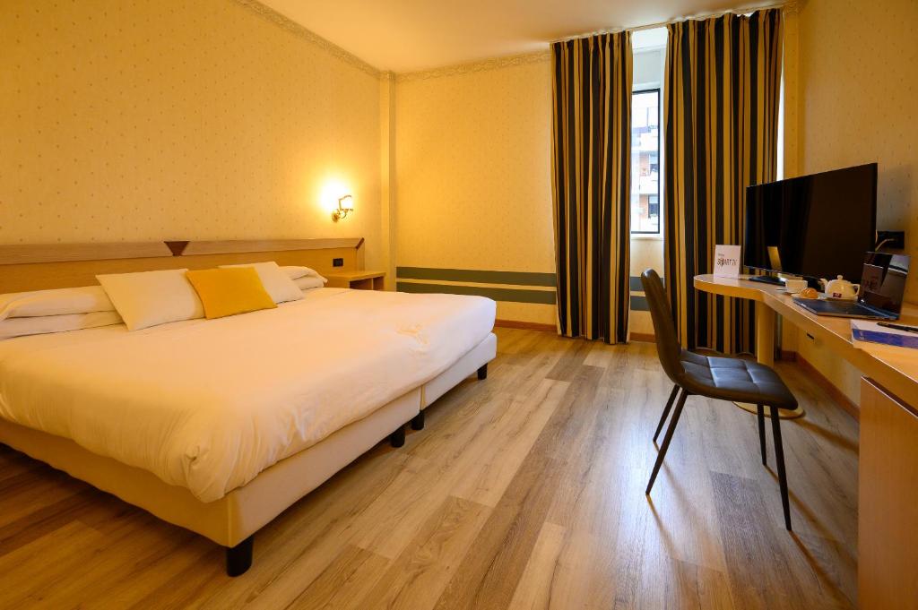 Postel nebo postele na pokoji v ubytování Hotel Torre Di Pratolungo