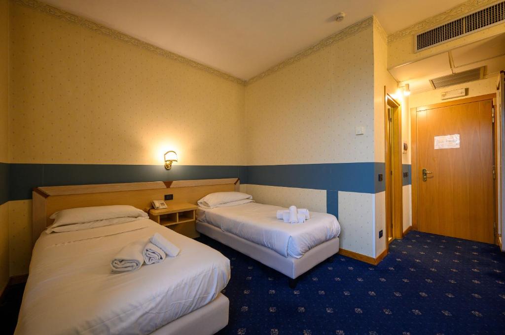 Postel nebo postele na pokoji v ubytování Hotel Torre Di Pratolungo